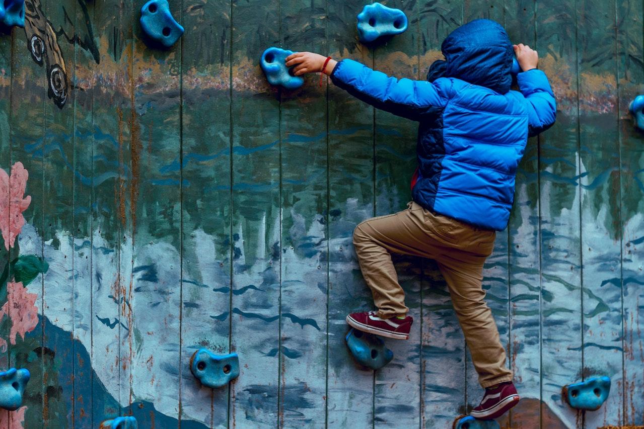 child climbing wall