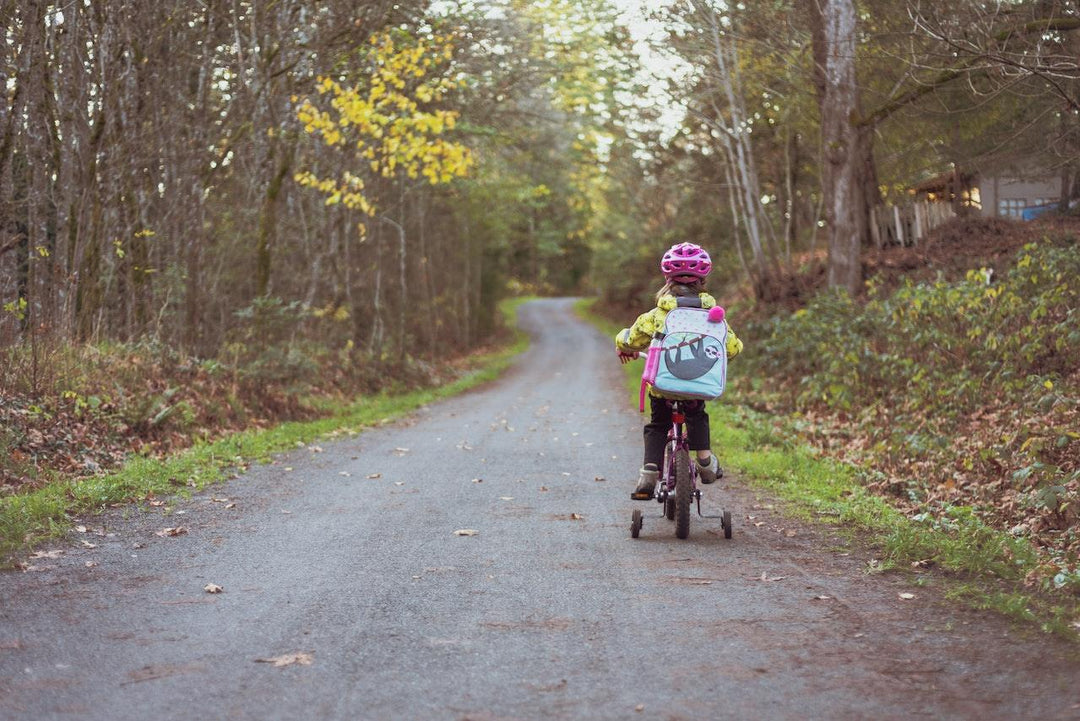 kid riding back outdoors