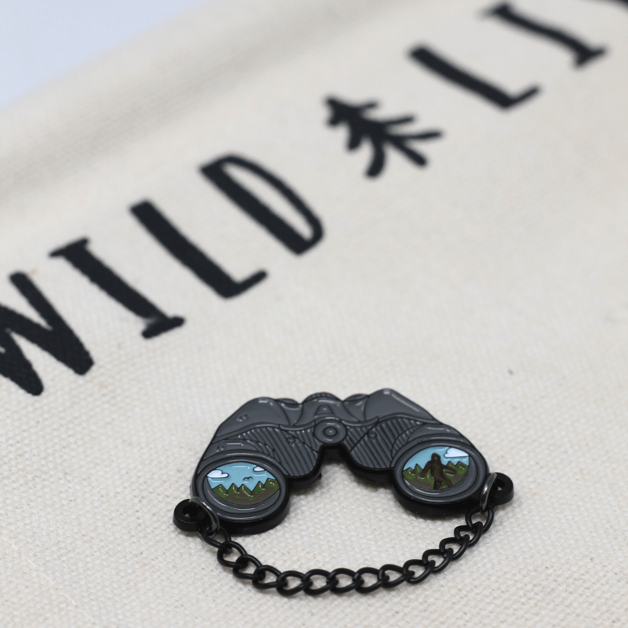 Binocular with Sasquatch Merit Pin - Wild | Life Outdoor Adventures
